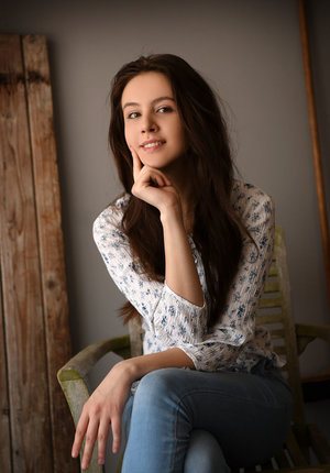 18 year old girl Katie Lewis stands naked after undressing in her bedroom